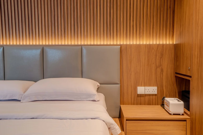 Sleek design with wood-textured walls and integrated lighting.