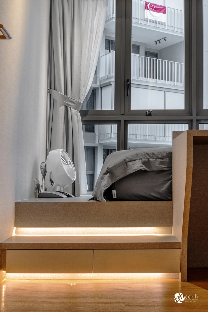 Integrated storage and warm lighting under the bed platform in a small bedroom design.