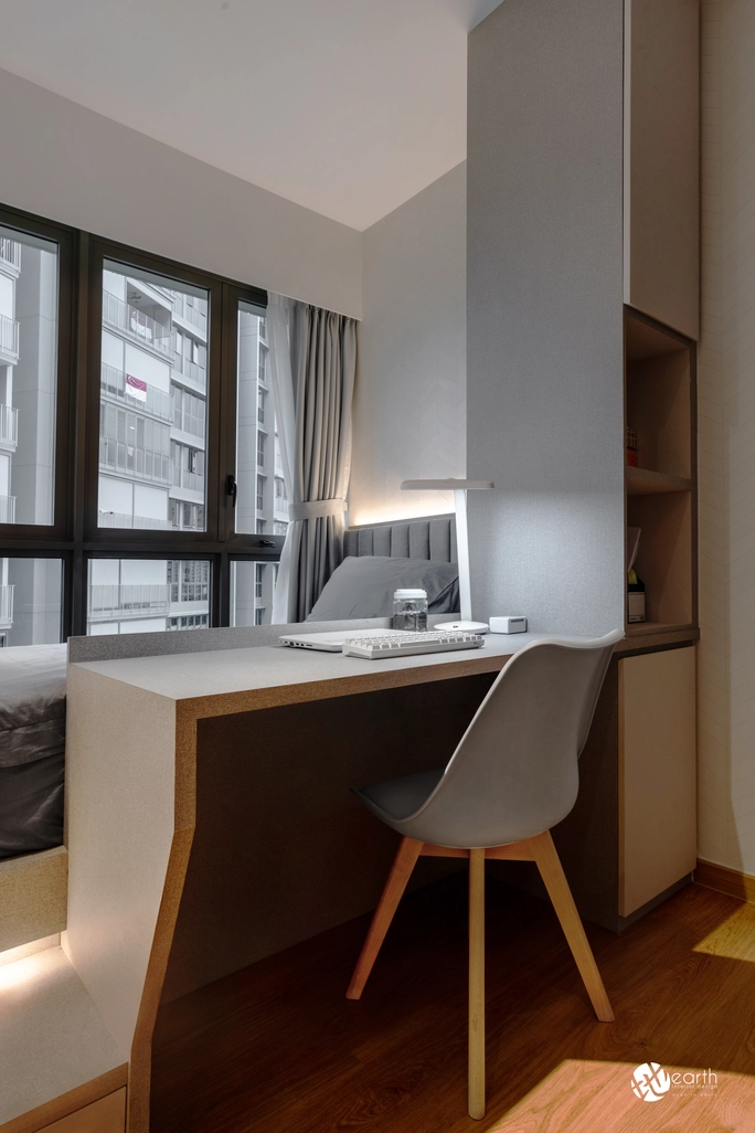 Small bedroom featuring a built-in desk and warm wooden accents for a functional design.