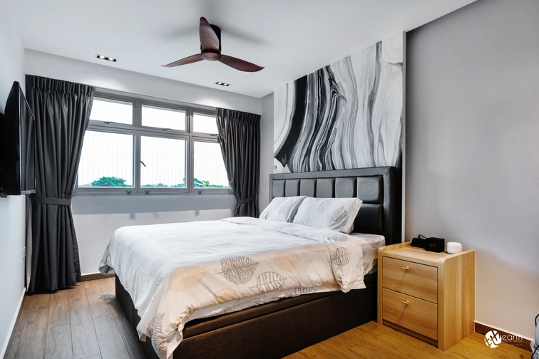 Cozy small bedroom featuring natural light and a modern wooden headboard.