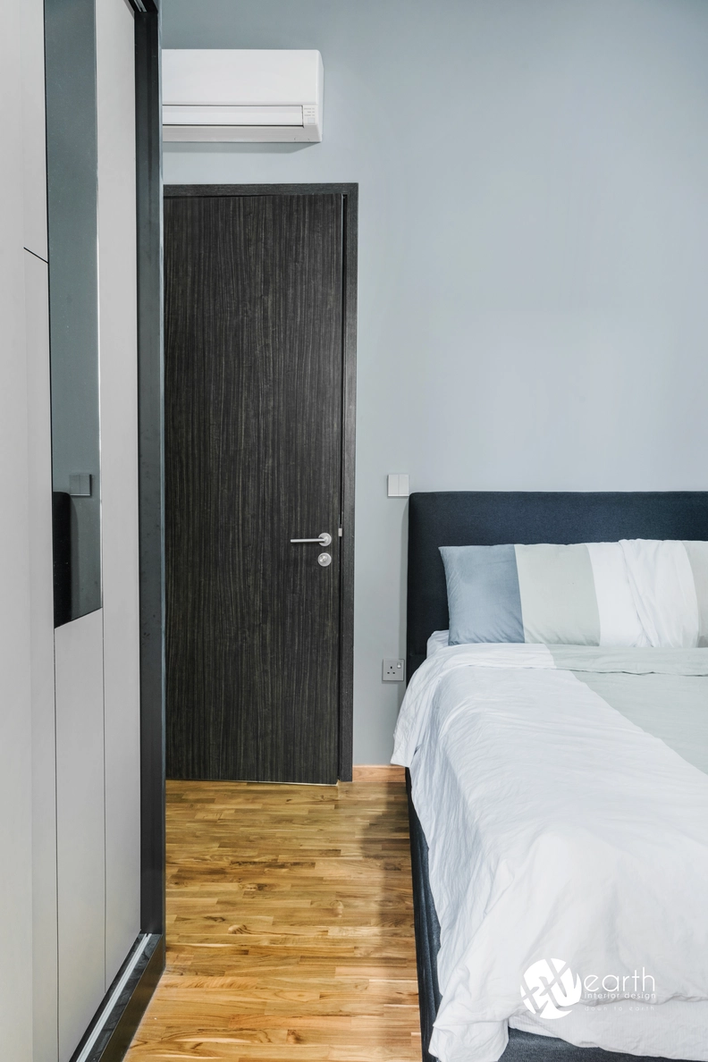 Minimalist bedroom layout with sleek bedding and soft gray accents.