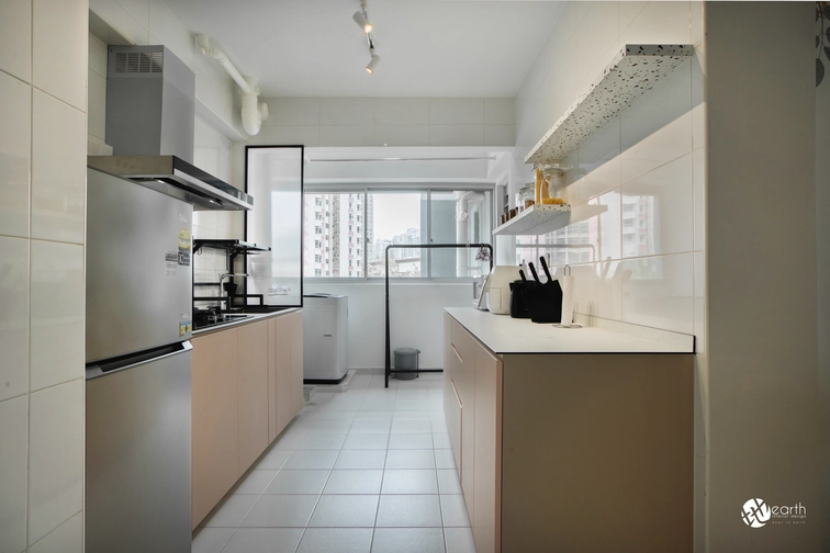 Functional kitchen layout with spacious beige cabinets and open shelving for added storage.