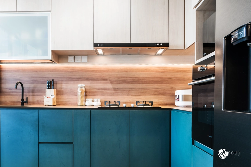 Compact kitchen with sleek black cabinetry and integrated lighting for a luxurious feel.