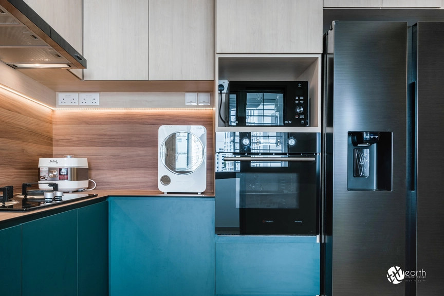 Modern small kitchen featuring black cabinets, a marble backsplash, and functional storage solutions.