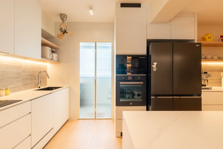 Small kitchen design featuring sleek white cabinets and built-in appliances for a seamless look.