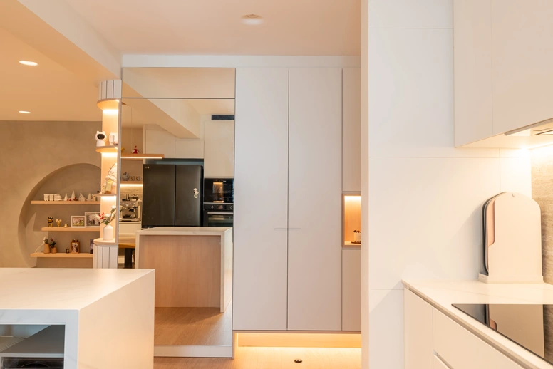 Small kitchen layout with a double-door refrigerator and integrated oven for space-saving functionality.