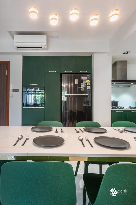 Stylish kitchen with botanical wall art and contemporary green furniture.