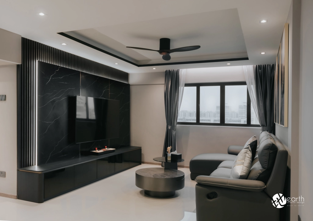 Full view of a monochrome-themed living room with grey furniture and modern black accents.