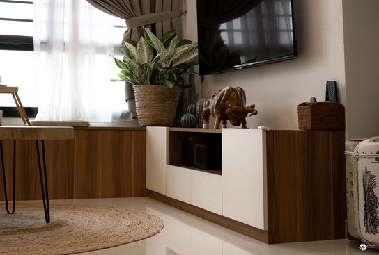 Modern TV console with wooden storage cabinets and minimalist design.