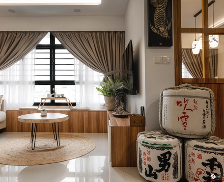 Warm-toned living room with modern decor, soft lighting, and Asian-inspired elements.