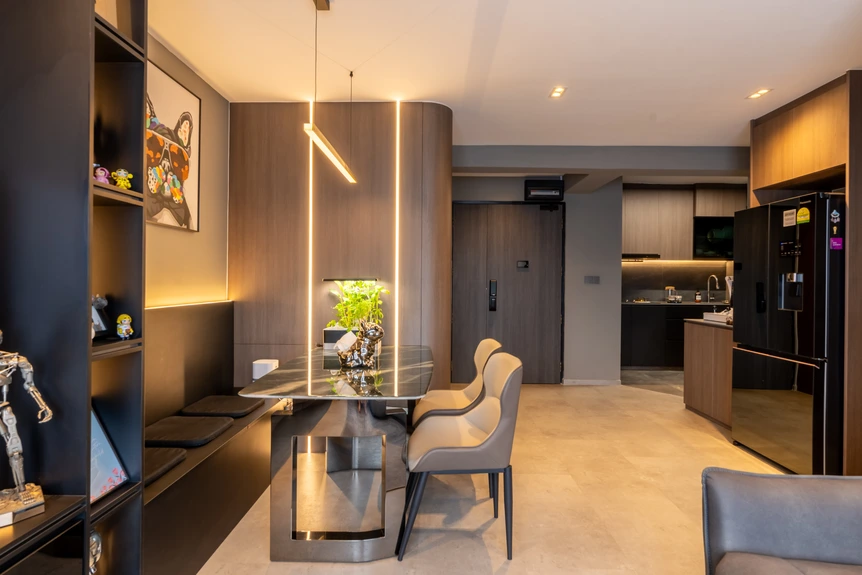 Contemporary dining area with modern lighting and a luxurious dining table setup.