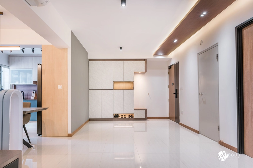 Spacious Singapore living room with a clean, modern design and functional built-in cabinetry.