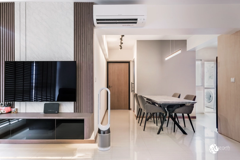 Elegant TV feature wall with wooden accents and modern console design in a living space.