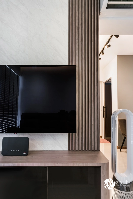 Detailed view of a wooden feature wall paired with sleek modern furnishings.